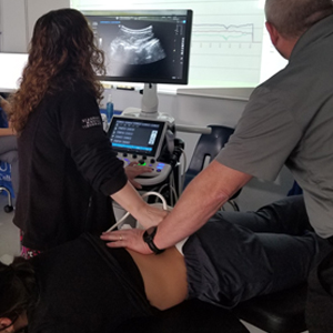 picture Manchester chiropractic ultrasound imaging of spinal vertebrae during treatment